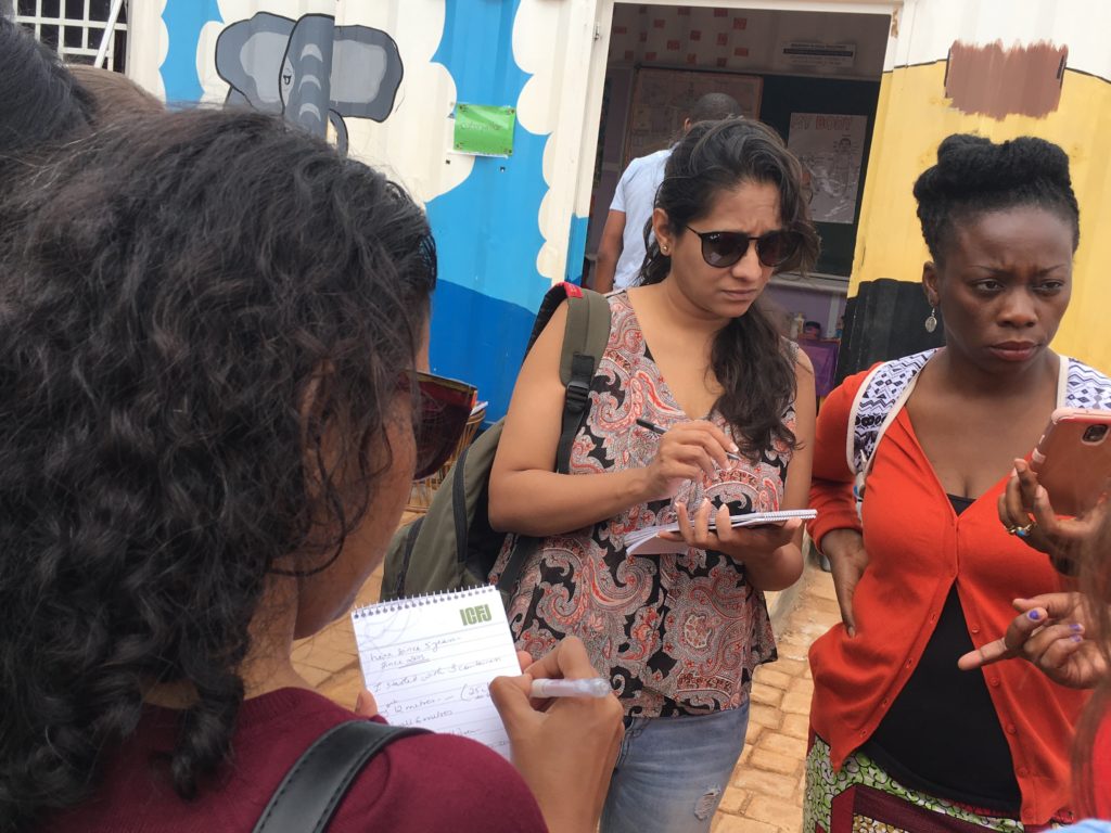 Three women receiving ICFJ training